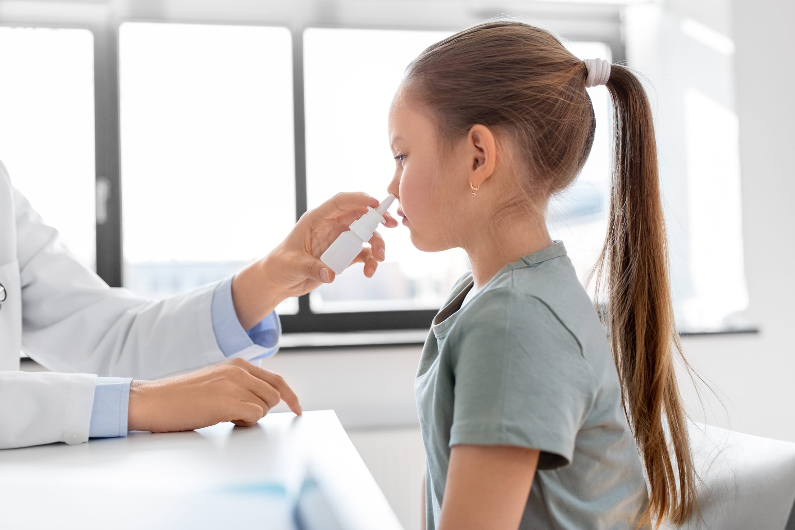 kid getting nasal spray